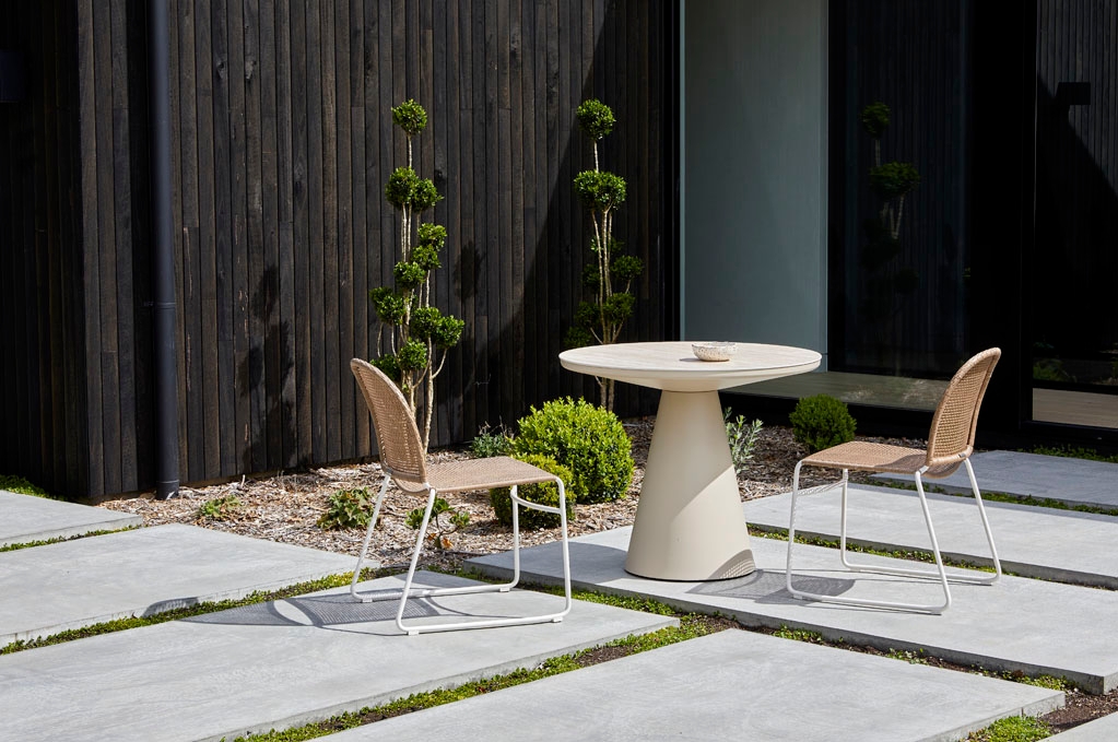 Lifestyle image of a outdoor 2 seater dining table by GlobeWest